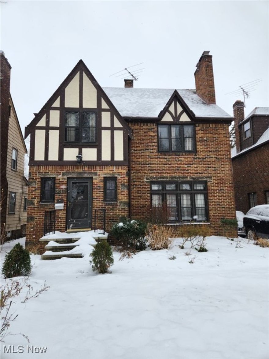 This large and spacious 4 bedroom colonial is nestled in the heart of Cleveland Heights, featuring four bedrooms and two and a half bathrooms. The very spacious house boasts lots of character, with wooden shelving and hardwood flooring throughout, contributing to its homy charm. The main level includes a large living room and dining room. The great kitchen, which has newer flooring and a  double sink,  looks into a stunning den illuminated by bright, large windows. The second floor offers three bedrooms and a full bathroom complete with a separate tub and shower; notably, one of these rooms features a walkout bonus room, which is perfect for a home office or work station. The third floor contains the remaining bedroom, a dedicated full bathroom, and an extra work or play nook. For entertainment, the home features a large finished basement complete with a bar.