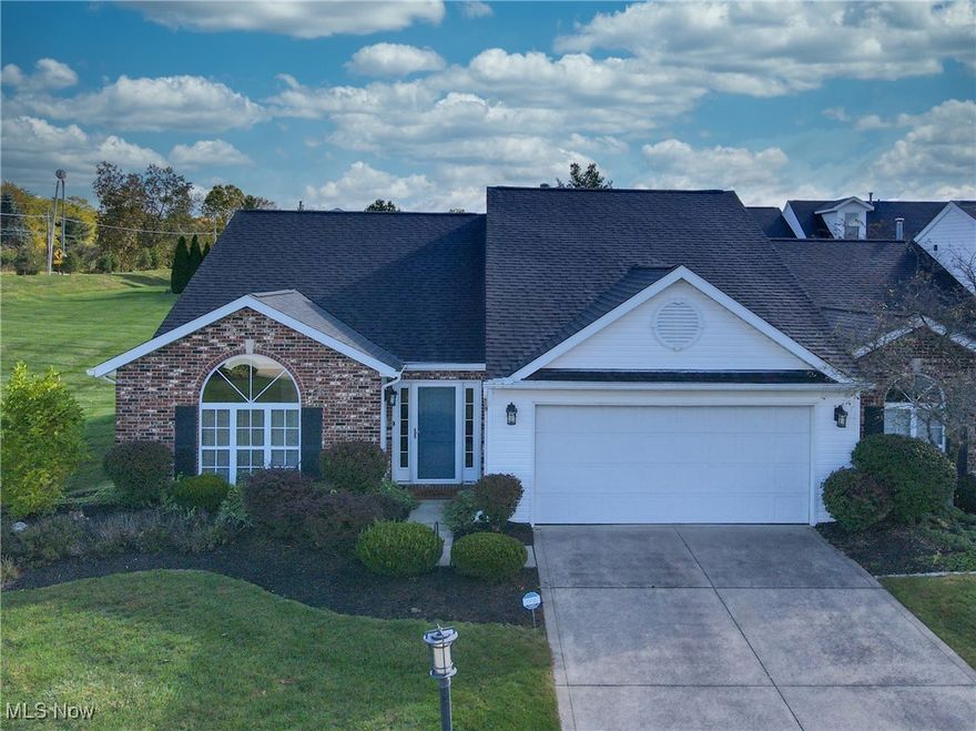 Welcome to this stunning Ranch-style cluster home featuring three bedrooms and two full baths. The third bedroom is currently being used as a home office, offering flexibility for your lifestyle. The open-concept Great room combines the living and dining areas under a vaulted ceiling, creating a bright and airy space perfect for relaxing or entertaining. A cozy gas fireplace adds warmth and charm, while a sliding glass door leads to the private patio and beautifully landscaped garden area. The white kitchen is lovely and has stainless steel appliances (approximately 5 years old), vaulted ceiling, and plenty of cabinet and counter space. The primary bedroom includes a spacious walk-in closet and private full bath. The second bedroom, located in the rear of the home, features built-in blackout shades for added comfort and privacy. Additional highlights include a combined laundry and utility room, a complete roof tear-off in 2017, and newer A/C installed approximately six years ago. Landscaping and snow removal are provided, ensuring easy, low-maintenance living year-round.