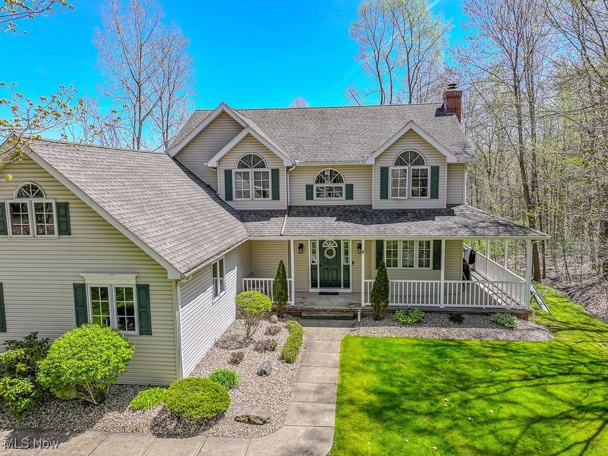 Welcome to this wonderful colonial in a great development in Munson Township. Nestled on a large wooded lot, cul de sac street enter through the welcoming wrap around porch. The foyer opens to the large living room w/ fireplace  & the cozy eatin kitchen. The kitchen has lots of cabinetry, granite counters, a breakfast bar & slider to the yard. All appliances are included. There is a lovely dining room overlooking the beautiful yard. A 1st floor laundry room & half bath complete the 1st floor. On the second floor, there is a huge Primary Bedroom w/ vaulted ceilings opening to an ensuite bath w/ whirlpool tub, shower & vanity. There are 3 other nice sized bedrooms & a full bath w/ tub shower. The full basement has a finished area perfect for a playroom and an area exercise room. Close to the back of the home, is the private man cave/ office w/ heat, electricity & paneling. The beautiful lot slopes down to the woods with trails & a firepit. This home is just minutes from historic Chardon Square , shopping, schools & more. Come home to serene country living, close to highways as well.