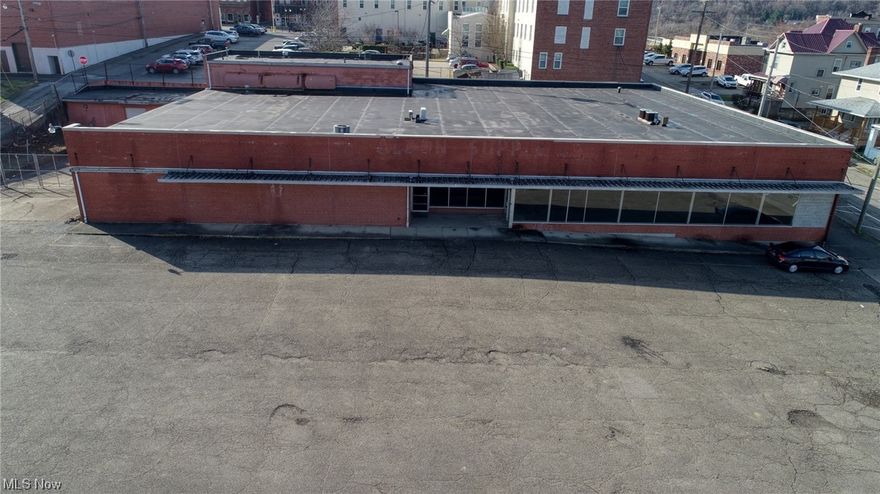 The possibilities are endless with this ideal property for any number of revenue-producing endeavors. Originally built in 1962 as the original Kroger supermarket then used as the Aldon Supply and Hardware more many years.  A solid 58,000 square foot structure with 3 phase electric and ceilings that reach nearly 15 feet. There are 3 loading dock doors for deliveries.  Located minutes from Interstate highways and one block from the downtown area. Many possibilities for rebirth such as another warehouse, skating rink or indoor facility for youth or adults. A restaurant possibly or center for religious organizations? Convenient location with plenty of access and parking add to the allure. Opportunity awaits, call today!