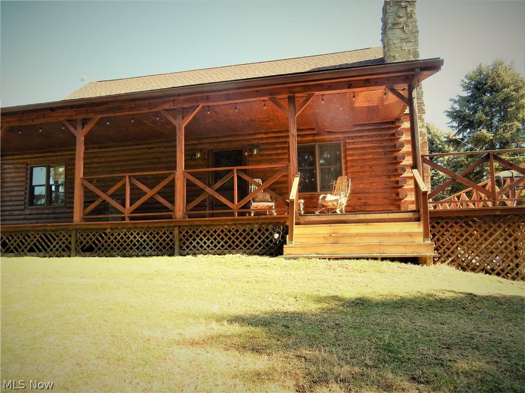 Say welcome home to this breathtaking, beautiful home with views to die for. So much to offer, both inside and out. If you're looking for a log home that is priced to sell, look no further. You won't believe all this property has to offer. Approximately 3 acres of fenced pasture, a small barn that is currently being used as a chicken coupe for free range chickens with additional fencing for the ducks and turkey. Inside, you'll love the open living space, warm and inviting living room with stone fireplace, rustic/chic eat-in kitchen, vaulted ceilings, and soaker claw foot tub, just to name a few. The loft is being used as a formal dining area with plenty of room to add an office. The large master bedroom with En Suite offers double closets and is a wonderful retreat with French doors leading to the back porch. In the walk-out lower level, you will find an additional 2 bedrooms, full bath, laundry area, and space perfect for another kitchen or additional living space. The owners are stic