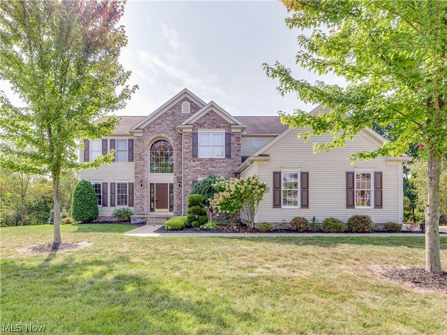 Prepare to be impressed by this spectacular Colonial in Pambi Farms with seasonal views of the river. Step into the 2 story foyer entry with open staircase and hardwood floors that extend into the kitchen. Elegant features in  formal living room and dining room include crown molding and custom wainscoting. Spacious eat in kitchen with newer appliances and sliders to the deck with a lovely wooded view! The kitchen also extends into the 2 story family room with beautiful cream fireplace mantle and built in shelves. First floor office with built in cabinets,spacious first floor laundry plus a 1/2 bath too! The master suite includes a huge walk in closet and bathroom with jetted tub and separate shower. Three more bedrooms, a jack and jill bathroom plus a loft which overlooks the family room . The finished lower level is amazing, it's open and bright  and it adds an additional 1479 sq ft . It has a huge rec room area, a full bath, plus an extra cozy area with a 2nd fireplace that could be