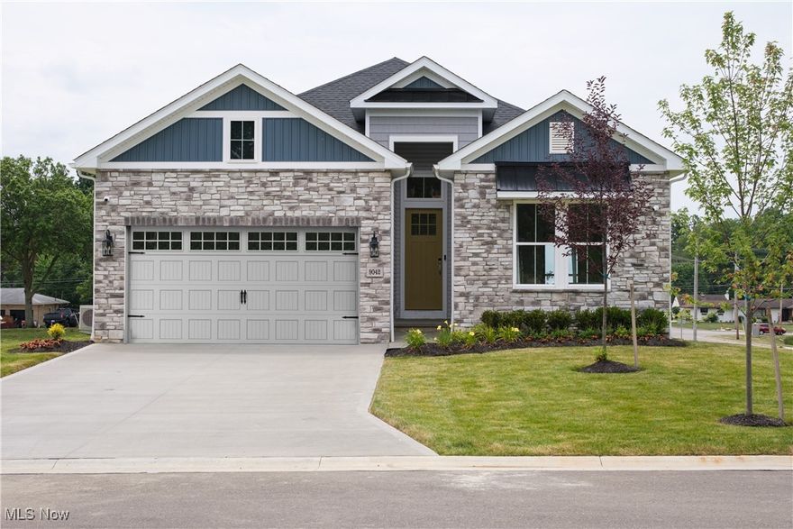 The wait is over—Heritage Park’s model home is officially on the market, with move-in scheduled for the first week of March. For those who have admired this home for years, now is your chance to make it yours. The foyer and primary suite both showcase custom millwork and tray ceilings extending to 13 feet, complete with elegant chandeliers. The primary suite offers enough space for a seating area and features a spa-inspired bath with a freestanding tub, oversized walk-in shower with tile to the ceiling, a rain showerhead, and frameless glass enclosure. The upgraded kitchen is a true showpiece with GE Café appliances, including a 36-inch gas stove, quartz countertops designed with the look of soapstone, backsplash tile extending to the ceiling, and under-cabinet lighting. All appliances are included, even washer, dryer, and refrigerator. The timeless design carries throughout with brushed nickel fixtures for a refined, classic look. The basement is fully finished with a bedroom, bathroom, daylight windows, large egress window, and abundant storage, making it perfect for family or long-term guests. Outside, the covered deck captures southern and western exposure and includes a gas line for effortless grilling and entertaining. The exterior stonework makes a lasting impression, the garage features an extra four-foot extension, and the premium homesite offers no neighbors on either side or directly behind. This one-of-a-kind opportunity combines designer upgrades, thoughtful details, and a truly desirable location in Heritage Park.