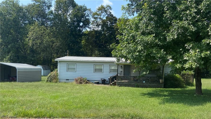 This property being sold as is to settle an estate. It is nearly an acre on the Hughes river, no flood insurance required. 1978 Double wide on a permanent foundation.