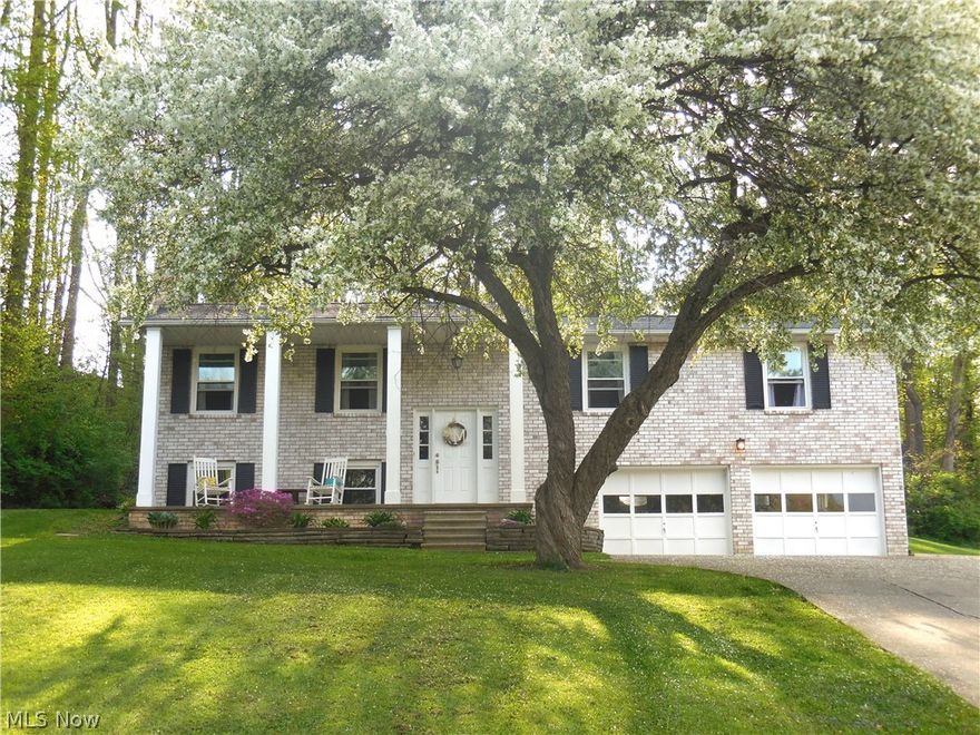 Welcome to this Beautiful Brick 4 bedroom Bi-Level in North Canton, Lake Township area. Its the perfect country setting the moment you pull up to the home with the large 2 story column porch. When you walk through the door you are invited by the updated kitchen with stainless appliances, newer counters, tile backsplash and wood flooring. The Living room also on first floor has neutral carpet and neutral decor. Lots of windows for natural lighting. Dining area also has wood flooring and is next to the large screened in porch for entertaining friends and family. You can relax and look out into the treed lot with wood fence and cute shed and private setting. Also on first level is 3 large bedrooms including access to full bath from Master bedroom. The Master bath is also newly updated with double sinks new flooring, toilet, lights, vanity and tub. New flooring also in the other bedrooms. The lower level includes a family room with brick wood burning fireplace and daylight windows. Also is