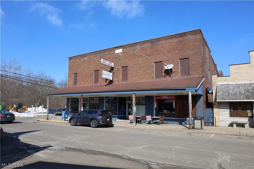 Online Auction begins ending Wednesday, March 18th, at 5:00 PM. Here is a rare opportunity to purchase a landmark property deeply rooted in the local lore of small-town America. Located in Killbuck, Ohio, this building has been home to various businesses since 1913, most recently operating as a convenience store and still housing the town’s Post Office. The main floor offers approximately 8,118 square feet and includes the storefront areas along with ample storage space in the rear of the building. The second floor features a theater and apartment units, presenting a value-add opportunity for renovation and redevelopment. An additional parcel is included, providing approximately 218 feet of frontage along Killbuck Creek. This parcel is currently used as a parking lot and is rented on a month-to-month basis, offering immediate income with long-term flexibility. With its historic character, multiple income streams, and redevelopment potential, this property offers a wide range of possibilities. Bring your vision and invest in a true piece of local history.