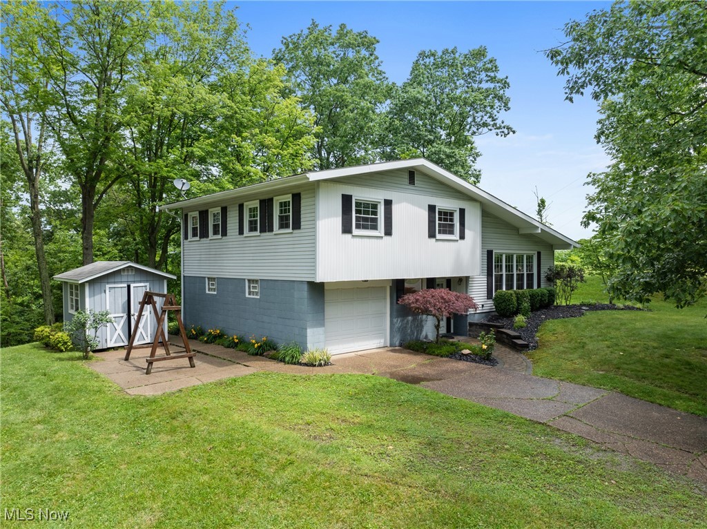 Tucked just outside of Shadyside in a quiet, desirable neighborhood, this well-kept split-level home offers space, privacy, and charm. Step inside to find a bright living area with oversized windows that flood the space with natural light. The layout offers multiple levels of living space, a clean and functional kitchen, and plenty of room for storage throughout. Enjoy the ease of a one-car attached garage and the move-in ready condition—everything has been well maintained. Out back, you'll find a peaceful deck area surrounded by mature trees and greenery, offering natural beauty and a sense of privacy that's hard to find. Whether you're looking for your first home or a forever home, this one checks all the boxes.