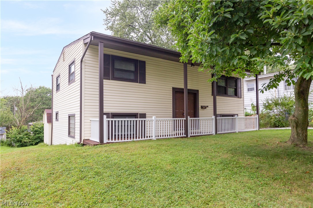 Well-kept bi-level with 4 bedrooms: 2 on the main level and 2 on the lower level. One of the bedrooms has an attached room that could be an office, or could be opened up to create a rec room on the lower level. There are 2 full bathrooms, one on each level. Walk-out lower level. Vaulted living room is open to the kitchen with bar area and seating area. Slider from kitchen offers access to covered raised deck and lower deck. Large shed and back yard with fire pit.