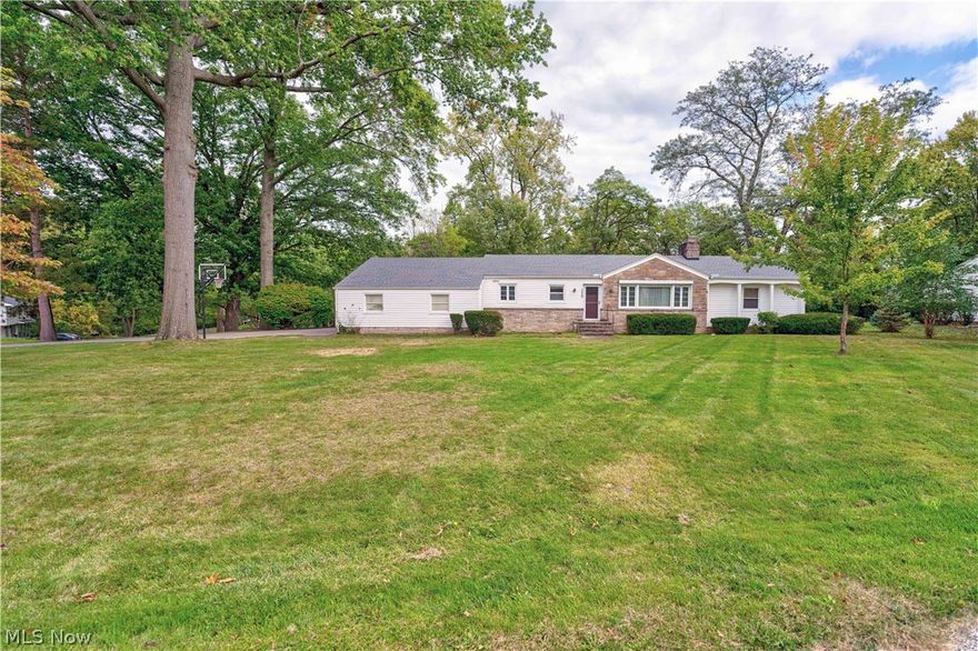 Welcome home to this pristine sprawling ranch nestled on a picturesque wooded lot in Elyria.  The open floor plan features an updated kitchen with maple cabinetry.  An entertainers dream living room and formal dining room boasts newer carpeting and wood laminate flooring.  Three generous bedrooms featuring two full and 1 half baths.  The full basement is partially finished with a wood burring fireplace adds fantastic living space.  Side load garage with basketball hoop, replacement windows, full tear off roof.  This home is ready for its new owners, call today for your private tour.