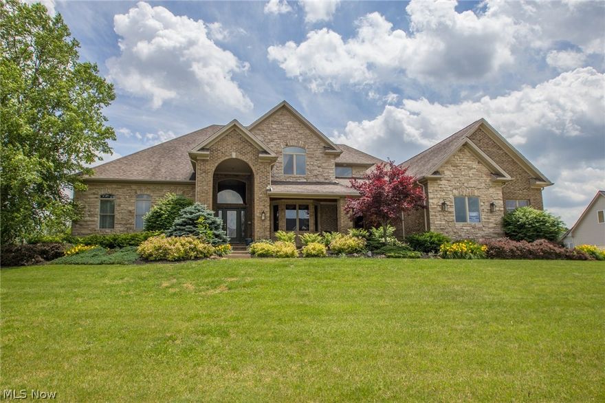 This impressive home is located on the fourth fairway of fox Meadows Country Club and offers beautiful water views, there is 6949 square feet of finished living area with a great open floor design. Enter into the large open foyer to the formal dining room with a separate built in butler's pantry and across the way is the formal living room with French doors for quiet and privacy. Continue on to the Gourmet cherry kitchen with granite counter tops, large island/breakfast bar, 2 pantries, loads of cabinets and great views from all windows, all kitchen appliances remain. Kitchen is open to the 2 story great room with a full built in service bar and floor to ceiling stone fireplace. First floor master suite and glamour bath with dual vanities, glass block shower, jetted tub,  2 walk in closets and large linen closet. Upper level offers 3 more spacious bedrooms, 2 full baths ( one is Jack and Jill ) and huge office or could be another game room. Back to the unique designed foyer with an ope