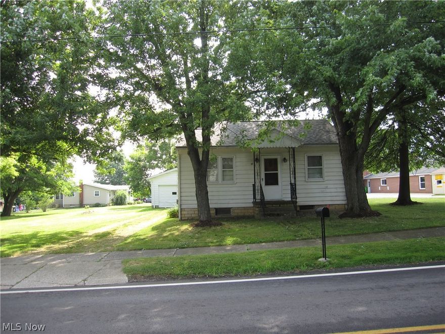 Cozy 2 bedroom, 1.5 bath Bungalow with a large Family Room at the back of the home and a nice sized living room at the front of the home which is currently being used as a bedroom. Nice built in's in the area connecting the bedrooms, living room, kitchen and bath and has a nice sized pantry off the kitchen.  Also has a newer roof with a large lot.  Possibilities are endless.  This property has a walk up,  23 x 12 area, that could be the 3rd bedroom if needed.  Just needs finished. If you like porches, this property has a nice back porch off the family room to sit and enjoy. The half bath is in the basement by the laundry area.  Don't hesitate, call today for an appointment to see this very cozy 2 bedroom, 1.5 bath Bungalow with lots of possibilities.