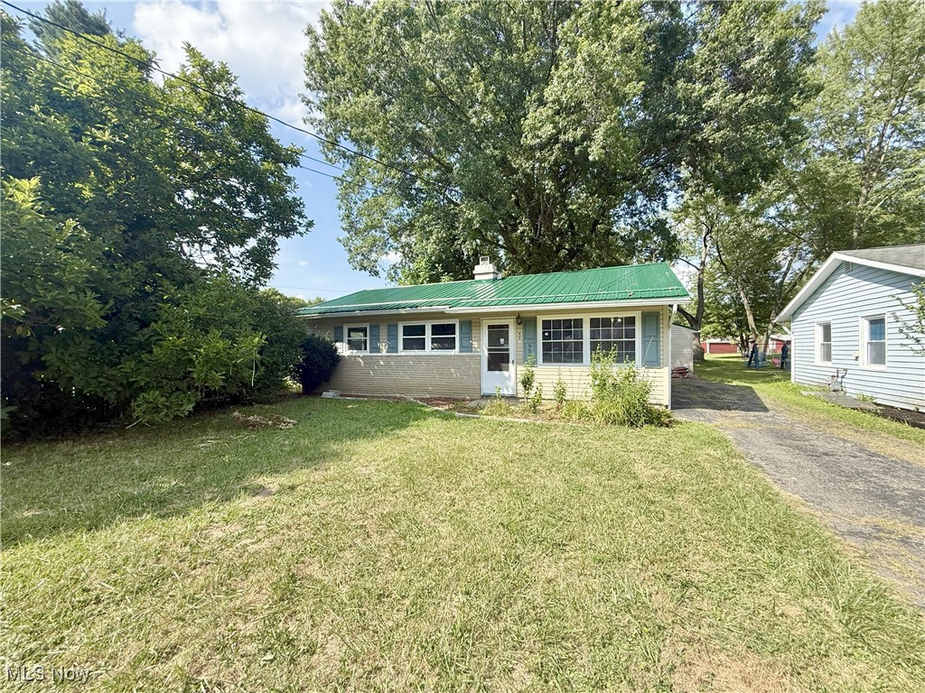 Welcome to this beautifully updated ranch home, perfectly situated on a quarter of an acre! Featuring a brand-new metal roof on both the home and detached garage, plus fresh siding on the garage, this property blends long-lasting updates with modern style. Step inside to find new flooring throughout and a fully remodeled kitchen showcasing granite countertops, soft-closing drawers, and contemporary finishes, perfect for everyday living and entertaining. The bathroom has also been tastefully remodeled, adding to the move-in-ready appeal. Additional updates include a new hot water tank and plumbing, ensuring peace of mind for years to come. With its modern upgrades inside and out, this home is a rare find that’s ready for its next owner! Schedule a showing today.