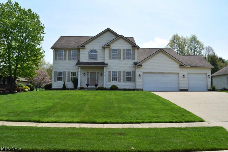 As you enter this 4 bedroom 3.5 bath immaculate 3200 square foot colonial, you will be greeted by a two story grand foyer with a hardwood entry. The spindled oak stairway climbs to an ample sized second floor with grand hallway that separates the bedrooms for privacy. The gracious master suite includes a walk in closet and luxurious bath with a double sink vanity, garden tub, and shower with two shower heads. The main level is designed for entertaining. The open floor plan, expansive room sizes, and 9 foot ceilings bring a feeling of spaciousness. The kitchen features granite counter tops, newer stainless steel appliances, and loads of cupboard space. The extra large serving island is adjacent to the dinette which allows for an informal eating area. The over sized windows throughout the house bathe the home in natural light. The formal dining room is accented by a beautiful tray ceiling with crown molding. The living room is tastefully appointed and located steps away from the formal d