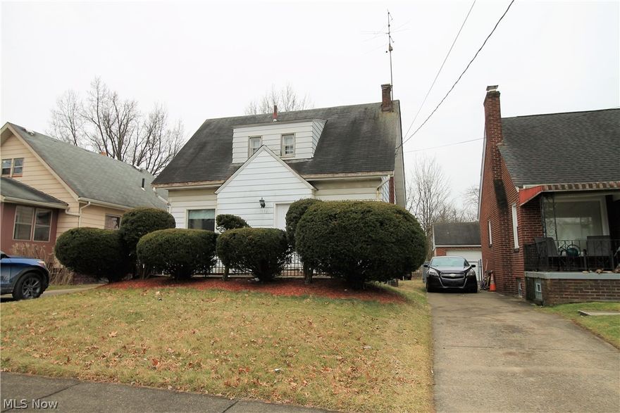 Investors! Great opportunity! Three bedrooms, one-half bath home. Wood flooring and fireplace in the living room. Gas pipes redone. Big two car garage. Endless possibilities!