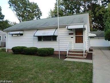 Must See this great 3 BR ranch with many updates. Just move in and enjoy. Freshly painted with new ceiling fans, new Stainless steel gas stove & refrigerator, new counter top, new sink, new faucet, new bath vanity and new toilet all in 2016. Both entrances have new screen doors 2016. New hot-water tank 2016. Updates in 2003 for "Quieter Home Program" include vinyl windows, interior doors, furnace and air, electrical with 100 amp service.Lower-level finished recreation room has knotty pine walls with bar/sink, new carpeting and new ceiling lights 2016. Half-bath and many built-in cabinets with a large workbench. The large backyard has built-in vegetable garden beds. Two-car detached garage with electric and a workbench. Many more updates make this a must see!Great Location, close to Kamm's Corner, Bus Lines, Restaurants and only a short drive to Downtown Cleveland and Cleveland Hopkins International Airport. This location provides fast and easy access to 1-90, I-71 and I-480. Walking di