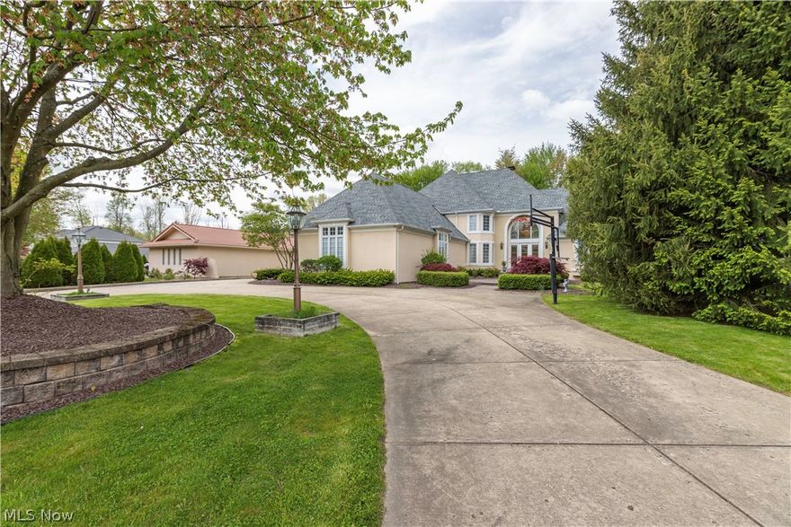 Absolutely Spectacular custom built 5 Bedroom 5 Bath home with 4 Car Garage & Private Scenic Backyard situated on a quiet Canfield cul-de-sac. The Home boasts an incredible 2 Story Great Room with Soaring Cathedral Ceilings, Fireplace, & Hardwood Floors. Gourmet Kitchen with Center Island, Breakfast Area, Granite Countertops, & Top Of The Line Commercial Grade Appliances. Formal Dining Room with ornate Crown Molding, Formal Living Room with Marble Flooring, First Floor Master Bedroom with Triple Crown Moldings & Triple Tray Ceiling, beautiful Master Bath & Ultra Large Walk-In Closet. First Floor Office with private Entrance. First Floor Laundry Room, & Awesome Back Sun Room Leading to large patio, yard & Outbuilding. Beautiful scrolled staircase leads to The Second Floor is home to 4 Spacious Bedrooms, 4 Large Walk in Closets, & 2 Full Baths. Lower Level is Completely Finished with 2nd Kitchen, Family Room Area, Media Room, Rec Room Area, & Bar Area. 3 Car Garage also offers Stairs to