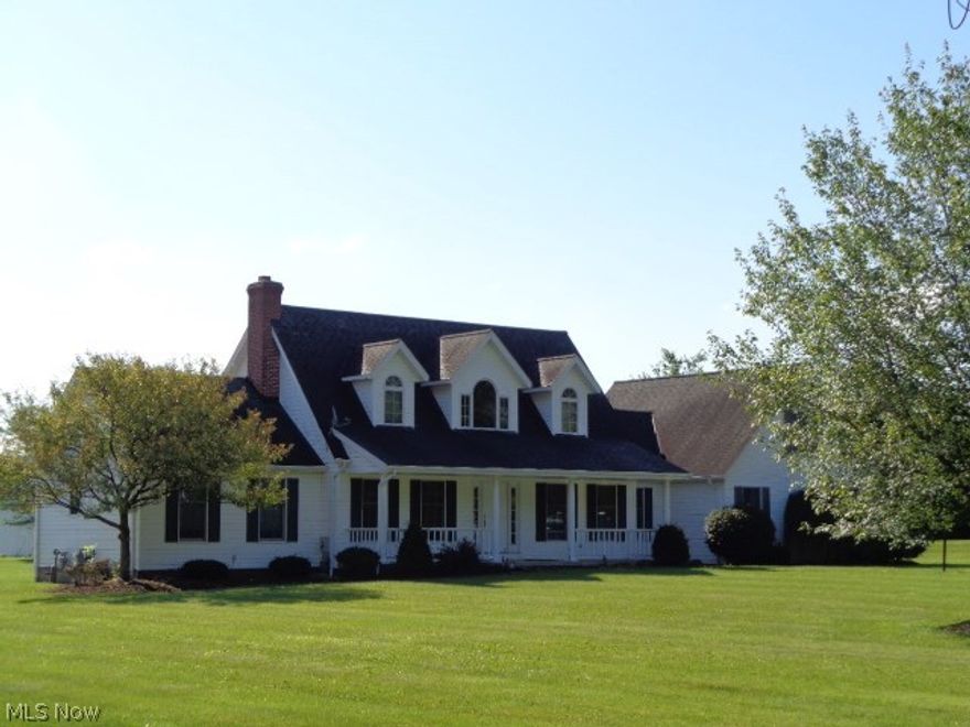 All the details and amenities of living in a beautiful country setting in this spacious Cape Cod with first floor master unit and
40 x 25 horse barn with 2 stalls, loft, tack room, on 1.8 acres of land. Wood Floors Are Maple with Matching Crown Molding throughout the
first floor living area and beautiful maple kitchen cabinets and built-in custom maple library at rear. Dining room has full built-in china
cabinet with wine rack, full walls of windows and sliding door leading to a deck. Huge Eat-in Kitchen with a breakfast bar with stools,
gourmet sink and ample counter space and kitchen appliance which include a refrigerator, gas range, dishwasher and microwave.
Gorgeous family room with brick wood-burning fireplace and built-in log storage and gas starter and recessed spot lighting. The second
floor bedrooms are mirrored images of each other off the main staircase from the 2 story foyer at the front entrance. 4th bedroom is
above the garage and is 27 x 11 and fully carpeted and