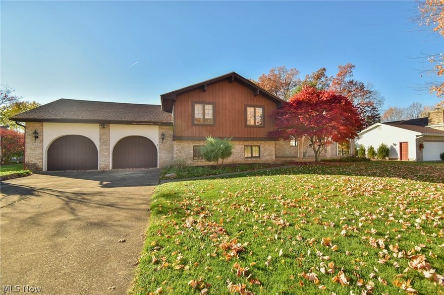 Original owner home in Beautifl Poland neighborhood!  3 bedroom split level house with Master Suite.  The main level features large open formal living and dining rooms.  Eat in Kitchen with appliances.  The lower level has a family room with wet bar and an office/4th bedroom.  And the lowest level is a wood shop.  Utility room and storage area .  The gem of this house is the great room addition- two story open room with lots of sunlight and natural wood work with built in trophy cabinets and shelving.  In addition the house has plenty of outdoor living spaces- a coverd front porch, 2 car attached garage, deck with sunsetter awning, and a 2 story outbuilding.  Home warranty included for a worry free purchase!  Call today for your private showing.