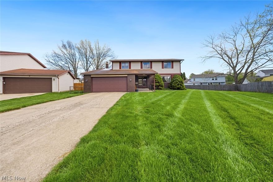 Experience the prestige of Deerfield Lake,one of Strongsville's most desirable and established communities, where opportunity meets location. This classic Colonial, filled with original 1978 character, is ready for your vision and updates. Perfectly positioned on a quiet cul-de-sac and just a short stroll from the neighborhood's sought-after amenities, including the pool, tennis courts, lake, playground, and clubhouse, the setting alone makes this a standout investment. Inside, you'll find four spacious bedrooms and two-and-a-half baths, including an owner's suite with walk-in closet and private bath ready for renovation. The kitchen and main living areas offer a functional layout with great bones, flowing into a large living room with fireplace, ideal for reimagining into a modern, open-concept space. The second level features generously sized bedrooms and a full bath, all maintaining their original charm. The large backyard includes a partially fenced yard with a concrete patio, plus a separate small fenced area near the garage, offering flexibility for pets or additional outdoor use. Complete with a two-car attached garage and located near SouthPark Mall, dining, fitness centers, and I-71, this is a rare chance to renovate in a high-demand neighborhood and build serious equity.