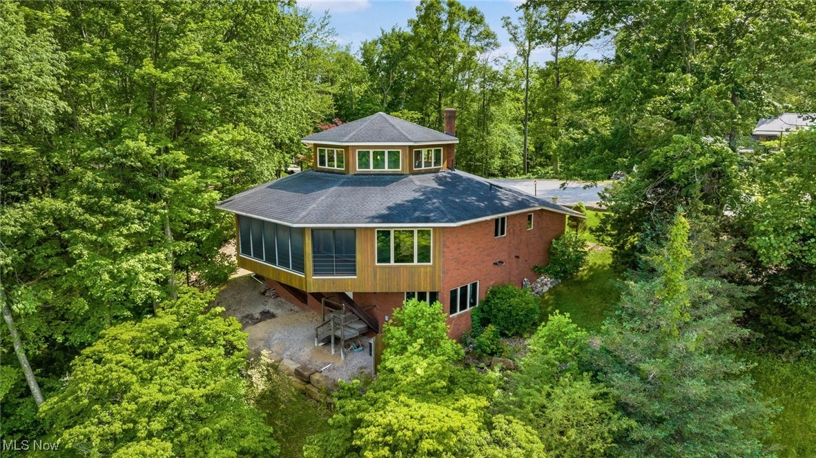 Discover sophisticated rural living in this expansive, contemporary home offering over 3,700 sq. ft. of beautifully designed space. Nestled in a serene setting, this property combines modern luxury with peaceful country views, creating the perfect retreat for those seeking comfort and style. Step inside to a natural light-filled, open-concept main floor that seamlessly blends living, dining, and kitchen areas—ideal for entertaining or relaxing with family. A convenient first-floor laundry room and built-in office add to the home’s functionality. Upstairs, the second-story loft area is a true showstopper, featuring a luxurious owner’s suite with wraparound windows that provide panoramic, unmatched views of the surrounding countryside—your private oasis above it all.
Enjoy every season in the inviting three-season sunroom, perfectly positioned to take in the changing landscape. The walkout basement offers additional space ready to be finished to suit your needs—whether a home gym, recreation area, or guest suite.
This home is a rare find, blending contemporary design with timeless natural beauty.