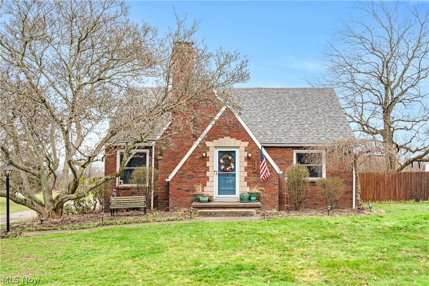 This cherished Cape Cod is the kind of home that simply feels right the moment you step inside. Full of character and timeless charm, it’s been lovingly cared for and thoughtfully maintained over the years.

Set on nearly ¾ of an acre in Columbiana Schools, this all-brick home offers four bedrooms and 2.5 bathrooms, with space to spread out both inside and out. Built-ins throughout the home provide incredible storage while adding to its classic personality, and the partially finished basement gives you even more flexibility for everyday living.

The kitchen stays true to the integrity of the home complete with a cozy drop-leaf table—perfect for morning coffee or casual meals. The main-level primary bedroom features cedar closets, adding both function and a touch of nostalgia.

Step outside and you’ll find a setting that feels just as special. A beautiful magnolia tree welcomes you out front, while apple trees and elderberry bushes add charm and character to the landscape. Out back, the screened-in porch is the perfect place to unwind and enjoy peaceful evenings.

Homes like this don’t come around often—where warmth, charm, and thoughtful care come together in a way that truly feels like home.