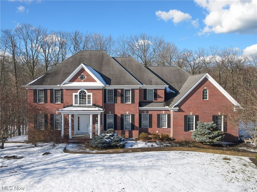 Situated on one of the most desirable 5-acre lots in the neighborhood on a cul-de-sac street, this beautiful Solon/Chagrin Highlands brick two-story home features bright and open spaces with plenty of room and unbelievable natural light and views! The entry leads to the beautiful foyer which opens to the soaring ceiling and wall of windows in the great room. Welcoming kitchen includes large center island, plenty of cabinet space and eat-in kitchen with views and access to the back deck. For larger occasions, the formal dining room w/ millwork is perfect for entertaining. The private office with French doors is a great work from home option, is light-filled and has great views of the back yard and creek beyond.  First floor laundry and mudroom area with access to the garage makes for easy in and out. The second level includes four bedrooms and three full baths. The oversized owner’s suite includes an extra large closet, sitting area and en-suite bath with dual vanities, soaking tub and large walk-in shower. Two bedrooms share Jack and Jill bath. Fourth bedroom features an attached bath, perfect for guests. The finished lower level is great additional space and features a large rec room, bedroom, full bath and access to the backyard. Warm weather will be enjoyed in the backyard that leads down to the creek. Home was built to take advantage of the great views. Ideal location in Solon with easy highway access and close proximity to shopping, restaurants, and Solon Rec Center.