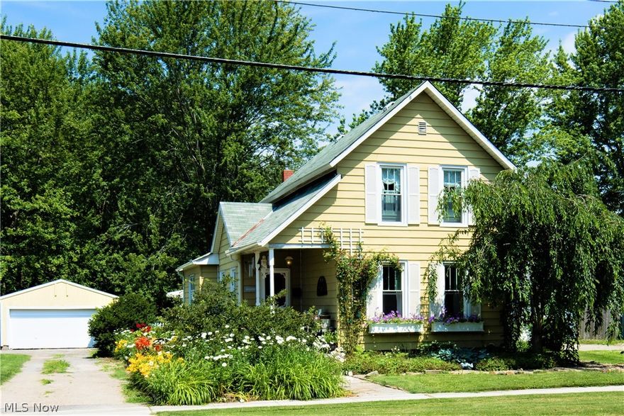 This adorable home is located in the Village of Grafton on almost a half acre lot.  The charm of this home will draw you in!  Lots of perennials line the walk to the front porch,  through the front door you enter into the large open living room and dining room. The country kitchen has  space for a breakfast table, from there you can step down to the utility room and laundry room.  The master bedroom and updated full bath are on the first floor. At the front of the home is another room that can be used as a bedroom or an office area.  Upstairs features 2 bedrooms and an attic area that could be finished as a walk-in closet. The basement has sandstone and Dutch walls.  There is a shower and toilet room down there that has not been used for many years.
Outside you have your own quaint pool house with a 15 x 12 trex deck plus a  pathway leading to the above ground pool with a large deck.  No neighbors behind you, the lot backs up to a field. So you get to have a piece of country in the ci