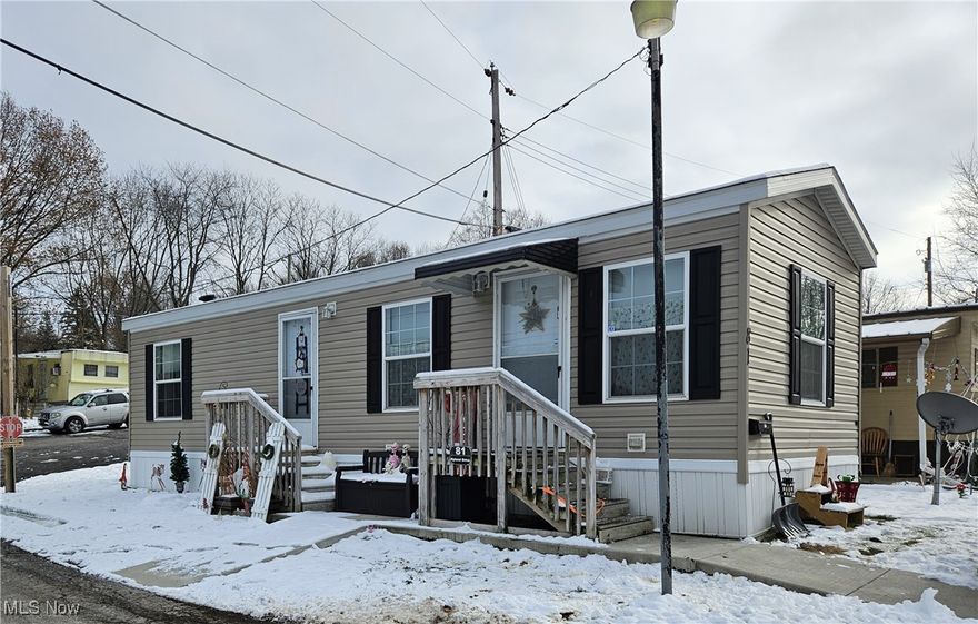 Welcome home!  Just like new! This home has been well maintained and is move in ready!  When you step inside this cozy home you will be pleased with the open plan with the kitchen that opens to the living room, laundry area, large full bath and 1 bedroom.  The exterior offers front porch area and a shed for storage.  This size home makes it easy to maintain!  Conveniently located within minutes of expressway access, shopping, eateries and more.  This is a great opportunity to own your own home and it's only 3 years young!  Call today to schedule your private showing.