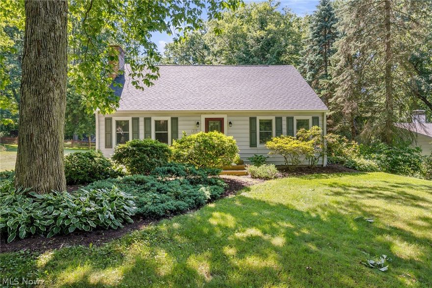 Pride of ownership shines in this 1-family owned home in the highly sought-after University Heights neighborhood in Kent! Thoughtfully designed, this surprisingly spacious home has over 2900 sq ft. of finished space and a welcoming main level with center hall staircase, gorgeous hardwood floors, 2 bedrooms, a full bath, formal living room with wood burning fireplace, and an efficient kitchen that opens to a large dining room with a bonus seating area. Kick off your shoes in the convenient mudroom that adjoins the roomy 2-car garage or relax on the large deck that is perfect for entertaining or curling up with a good book and a cup of coffee while taking in the serene surroundings and lush landscaping. Upstairs, are 2 generous bedrooms and another full bath. The full basement provides additional living area with a finished recreation room and bonus room that could be converted to a bedroom, as well as an unfinished side with plentiful storage, washer and dryer, and newer HVAC (2018).  A