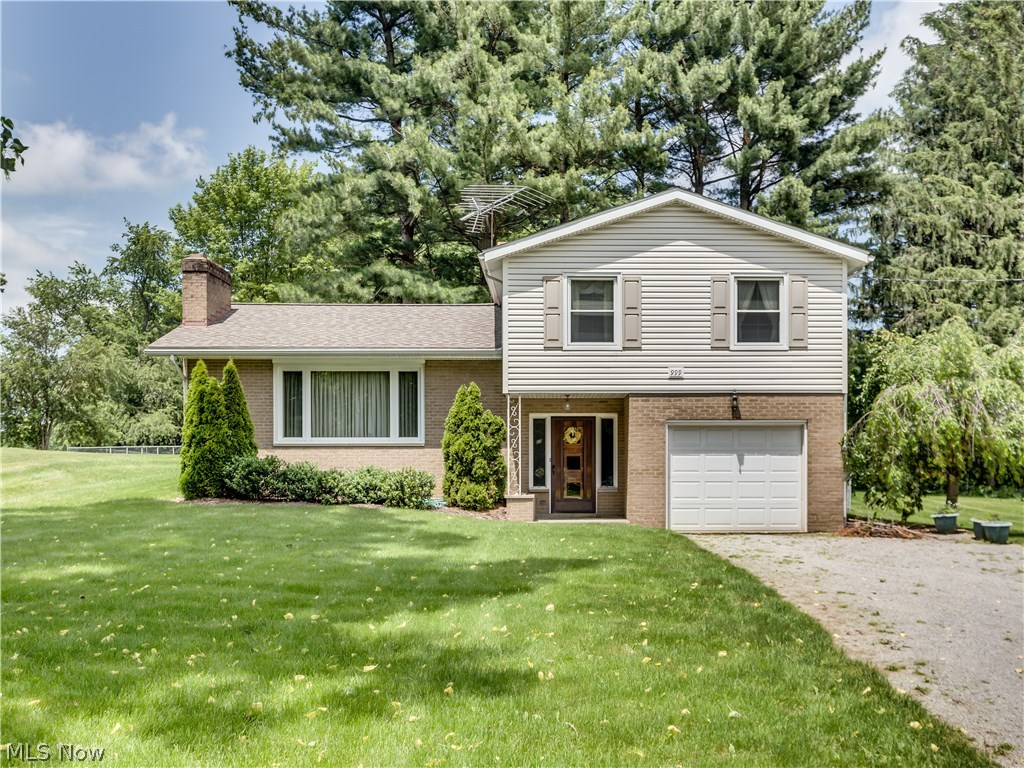 What an opportunity! Move in and enjoy or update to your own preference. This spacious split level offers a formal living room that features a vaulted ceiling and wood burning fireplace, an eat in kitchen that includes all appliances (fridge and stove are stainless steel), and a dining room with a slider to the patio. Natural sunlight from the huge picture window accentuates the gleaming hard wood flooring. There are 3 large bedrooms and a bathroom with double sinks on the second level. The 4th bedroom is located on the main level and could also be used as extra living area. The partially finished basement features a wood burning fireplace. Updates in 2007 include roof, windows, septic and vinyl siding. The hot water tank was recently installed. The 100x300 yard is partially fenced and gives you plenty of room for outdoor activities. Don't miss the chance to preview this great home. Call for your private showing today.