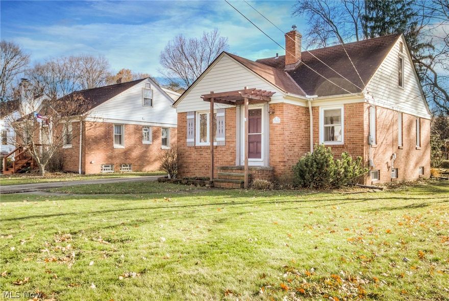 Beautiful Brick cape cod has "home" written all over it.  Custom tile foyer greets one upon front entry, leading to the spacious living room which is adjacent the open dining area with built-ins.  Cooks kitchen is complete with tile flooring, all appliances stay including that new dishwasher.   First floor full bath and 2 bedrooms with hardwood flooring allow for one floor living if so desired.   Huge upper dormer is bedroom number three and is a great alternative for a master suite.  The lower level is partially finished and includes a 1/2 bath.  Tons of cubbies, built-ins, and closets to accommodate ones belongings.  Great yard with fire pit.  Convenient location with easy access to major freeways.  Downtown CLE is just 14 miles away.  Close to parks, shopping, restaurants.