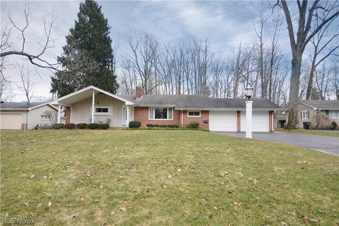 If you are looking for a Poland Brick ranch with lots of space and natural light, make sure you put this adorable home on your must-see list! This home sits on over 1/2 acre with a 2 car attached garage. The foyer leads into a spacious living room with hardwood floors underneath the carpeting, and a gorgeous 3 sided sandstone wood burning fireplace. Cozy piano nook has lots of different possibilities as well right in the living toom The dining room leads out to a railed wooden deck, where you can view the partially wooded lot. Hardwood floors under the carpeting in the dining room as well! Into the kitchen you'll find a cute built-in table and ample cabinet space, with a built in oven, and refrigerator to stay. Large bedrooms with great closet space, hardwood flooring and a master bedroom with full master bath! 2 full baths have been well kept and clean. The full basement has so much space to offer with a carpeted rec room, bar area, and large utility room. Additional toilet in the ba