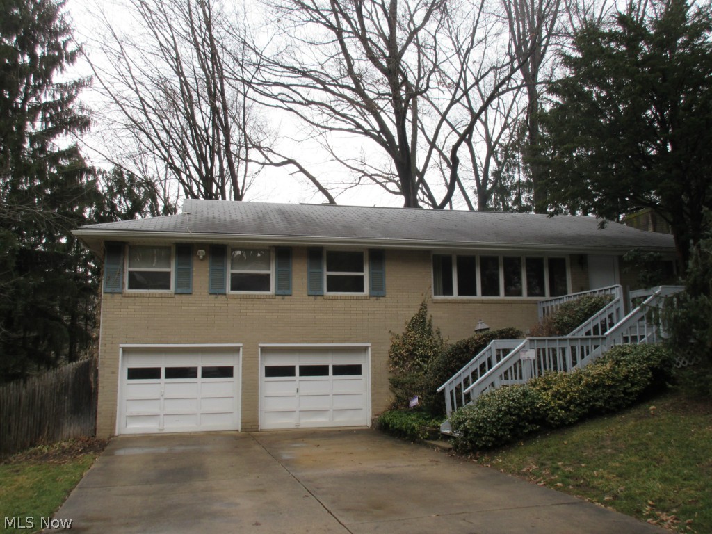 SUPER VALUE & GREAT LOCATION for this 3 BR, 2.5 BA brick home. Plenty of space includes 3 separate living areas, large applianced kitchen area with island and breakfast bar plus updated cabinets. The finished rec room includes a separate office area, a cozy family room has an attractive fireplace and the spacious living room has plenty of natural light. The master bedroom includes a master bath. Enjoy the full length, elevated deck overlooking the private, fenced back yard. Or relax and grill on the side patio. New in 2014, includes a high efficiency Lennox furnace, Lennox central air and hot water tank. Your search ends here!