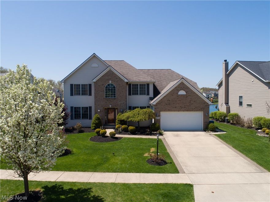 Wonderful, 5 bedroom, 4 FULL bath, 3,486 sq ft, custom-built Garland Griffin brick-front colonial in Woodgate Farms! Beautiful, professionally landscaped yard with sprinkler system adds inviting curb appeal! The grand, two-story foyer with open staircase welcomes you and flows into the spacious dining room with tray ceiling or the large home office with built-in book shelves! The two-story Great room with marble, gas fireplace and large windows, opens to the spacious eat-in kitchen with custom-made maple cabinets; Chefs Island, tile backsplash and gorgeous granite counter tops!  Morning room with lots of natural light, leads to the patio and back yard which overlooks the serene pond! First floor laundry, 5th bedroom and full bath completes the main level with 9 ft ceilings. The second floor owner’s suite with vaulted ceiling offers a large glamour bath with jetted tub and walk-in closet.  You will love the amazing, finished lower level, featuring a full kitchen with all appliances and