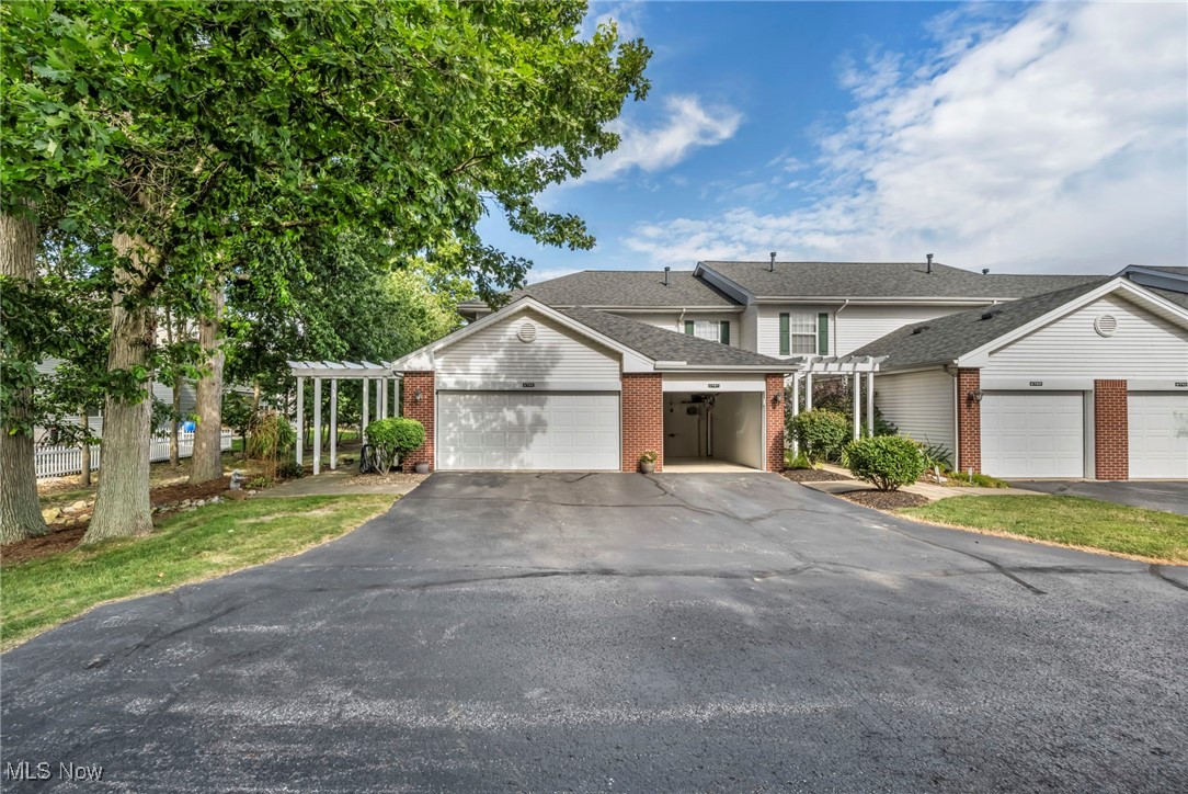 Welcome to affordable luxury in a prime location! Beautifully maintained & updated end unit offers the privacy & feel of a single-family home with the convenience of a 2-car attached garage and a rare private side yard at the end of a quiet area. Updated kitchen features oak cabinetry, a functional layout with a breakfast bar, and a charming eating area with a window for natural light & views. Cooks will appreciate the all-inclusive appliances and layout designed for both function and comfort. The seller has upgraded with stylish and durable luxury vinyl tile flooring, adding warmth and elegance. Open-concept great room is flooded with natural light from double windows and includes a sliding door that leads to a generous 12x10 deck—perfect for entertaining or relaxing outdoors. Half bath and a full-sized washer/dryer area with a storage closet add to the home's convenience. Upstairs, the vaulted king-sized master suite offers a tranquil retreat, featuring an alcove area ideal for reading or relaxing, two large closets, and a ceiling fan. The freshly updated bath includes a large vanity, full tub/shower combo, & linen closet. Nicely sized guest bedroom with a double closet completes the second floor. Spacious attached garage includes water, a floor drain, and attic storage. Updated baths,, and peaceful treed surroundings make this a turnkey home. Enjoy the well-maintained community with access to a lake, picnic pavilion, fishing, walking paths, and lush grounds—an ideal setting for nature lovers!