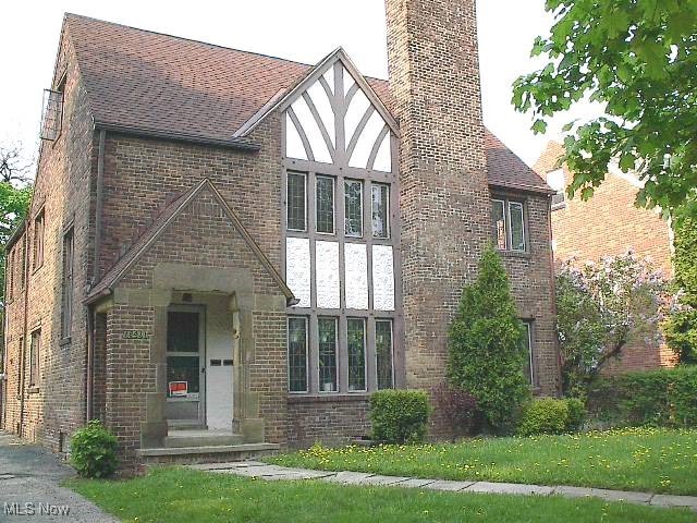 Handsome Brick Tudor. Well maintained ready to occupy. First floor, 3 bed rooms & bath, oak floors, rear porch, 2nd: 3 bedrooms & bath oak floors, 3rd: Private entrance 1 bedroom and family room, 1 full bath. Appliances not included-Negotiable. Updated hot water tanks & boilers, 3 car garage. Short distance to Van Aken Market District. Let rental income pay most of your expenses. Listing includes an addition lot which can be used for additional yard space. Lot is also buildable, please check with the building department for specifics.