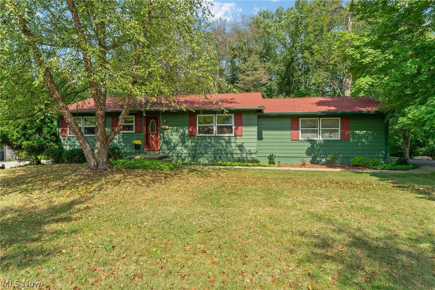 From the moment you walk into this cozy ranch, you’ll feel right at home. Vinyl floors and painted cabinets bring warmth to the eat-in kitchen. Beautiful hardwood floors flow throughout each of the three bedrooms, hallway, and spacious living room. A half bath is attached to one of the bedrooms. The lovely full bath on the main floor has nice neutral tones, a bath/shower combo with new tile surround and new floor. Down the open stairs, you’ll find a beautiful finished walk-out basement with recessed lighting, bar, and massive storage room with a workbench. A laundry room with toilet and sink and nice counter space complete the basement. All appliances, including the gas washer and dryer stay. The French doors in the basement bring you to a lovely brick patio with a park-like view, a gorgeous black walnut tree, and lots of deer and wildlife. This home has been well maintained by a single owner and is within walking distance to the hospital, food, and shopping. Resting on a quiet dead en