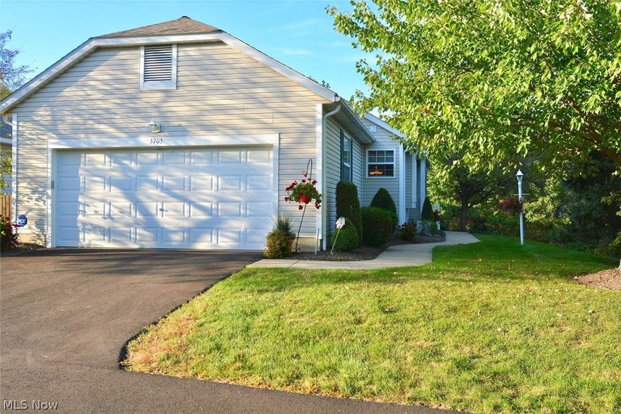 This fabulous condo has it all! It is beautifully maintained and updated throughout! There are FOUR bedrooms & 2 1/2 baths! The eat-in kitchen has beautiful granite counters & back-splash, a stainless steel range and refrigerator, wood flooring, a pantry, and a window seat! The great room has a vaulted ceiling (w/ceiling fan), a gas fireplace, and sliding glass doors leading to a beautiful four-season sunroom, AND a screened porch just off the sunroom w/fabulous views of the backyard! The master bedroom has a vaulted ceiling (w/ceiling fan) that easily accommodates king sized furniture, and there is a door leading to the screened porch from the master bedroom! The master bath has a jetted tub as well as a new step-in shower. The 2nd bedroom (w/ceiling fan) is just steps from the main bathroom, making it a perfect guest bdrm. The 1st fl laundry, just off the garage, has cabinets and a large closet for storage, as well as a sink w/a drain in case of overflow. A huge family room, 2 more b