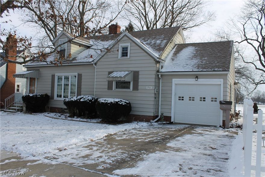 Charming Cap Cod ready for a new owner. This home has had top notch care and updates were not left behind. The home has 3-5 bedrooms including a den/sitting room on the main floor and a finished room in the basement currently used as a bedroom. The kitchen has had some updating and the entire home has new vinyl windows and new doors. The attached porch has nature stone flooring as does the attached garage and basement. The home is setting on 2 lots with a white vinyl fence around the additional lot and is open to the rear with the new elementary school land behind.