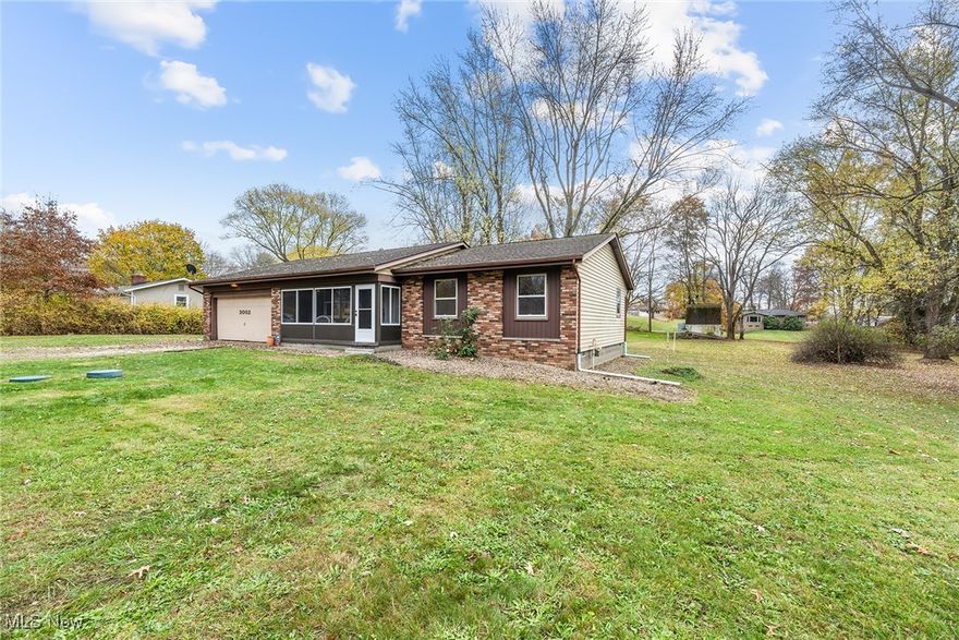 Welcome home to this updated ranch in Uniontown! The stunning, newly remodeled interior features an updated kitchen, brand new floors and paint, and both baths have been completely renovated! Inviting warm neutral colors throughout.  You'll enjoy space to spread out with a large living room as well as a multi purpose family room (or maybe dining room?) with a charming vintage wood burning stove and sliders out to the back patio. Nicely sized bedrooms with good closet space.  Primary bedroom connected to a Jack and Jill half bath that is large enough to possibly add a shower or first floor laundry.  Welcoming covered and screened front porch to soak in the scenery.  Convenient attached 2 car garage. Situated on nearly an acre, the serene lot offers mature trees and privacy. Large shed for plenty of outdoor storage!  New furnace in 2024 and updated septic.  Dont miss this one!