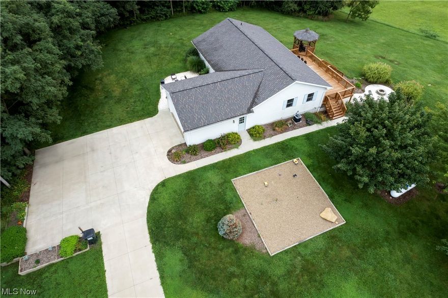 Check out this Beautiful Country Ranch home with a Hilltop Setting and Spectacular Views of Holmes County rolling hills on 5.5 Acres. This home is currently operating as a Vacation Home and is turn-key.  Located just minutes from Mohican Country and Amish Country.  Enjoy nature and relax on the expansive back deck with attached gazebo, custom patio with firepit or the cozy front patio area.  As you enter the home you are greeted with an open concept and mid-century modern de cor.  The updated kitchen is bright and invites you in for the gatherings.  In the living room is a brand new custom fireplace and seating along with a sliding glass door that leads from the living room to the large back yard deck.  Down one short hallway you will find a guest bathroom and 2 bedrooms with a fun mural, hand-painted by a local artist. Down a separate hall is the primary bedroom that boast of color and character, a complete on-suite bathroom. Large and spacious first floor laundry and mud room is off the 2 car attached garage.  Many new updates: flooring, renovated bathrooms, paint, lighting, backsplash and more. This home has Central air, concrete driveway and full walk out basement.  This is a beauty to own!! Whether you occupy full time, keep as a Vacation home or rental, Call today for a private tour.  Hours and days may be limited as this is a operable Air BNB/VRBO property. Please do not enter the driveway unless you have a private tour scheduled.