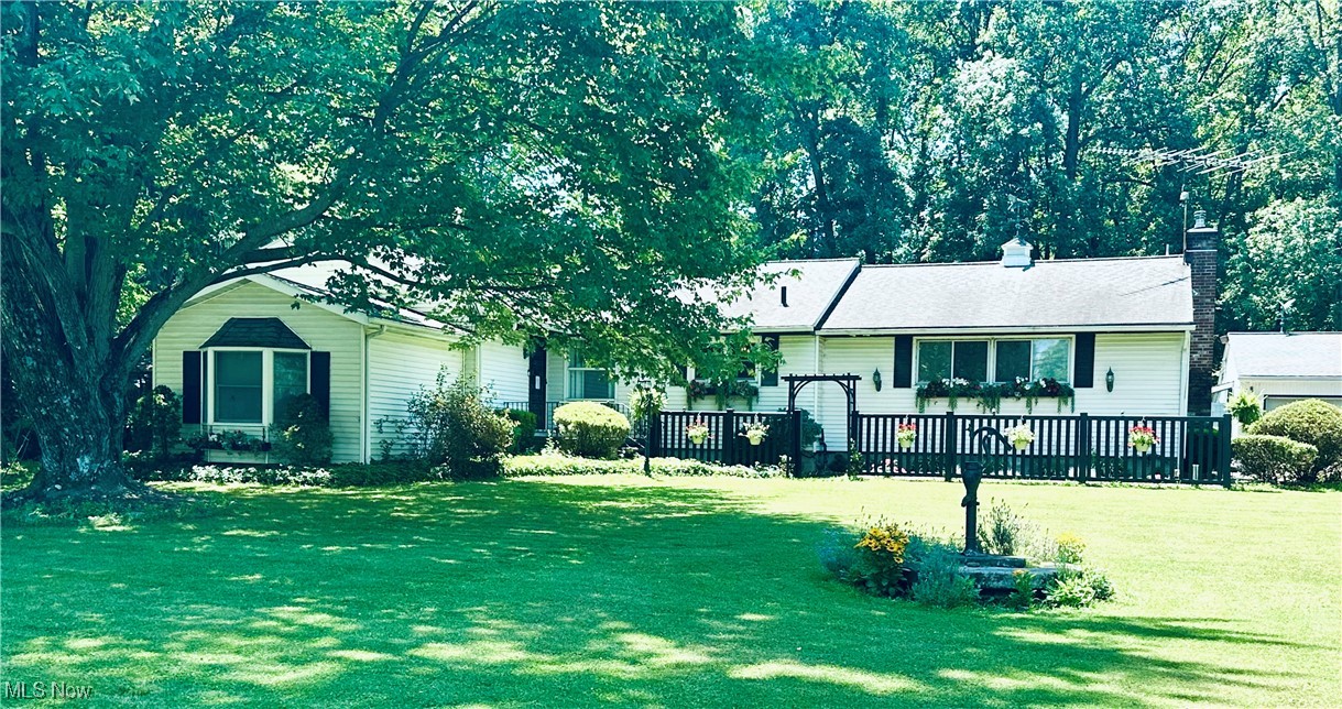 Have you been waiting and waiting for the perfect place to raise your family? Welcome to this stunning home situated on 3 acres where everything has been designed for living an exceptional lifestyle! Spacious open floor plan featuring LVT flooring. A wet bar and full wall gas fireplace adorn the family room. A dream kitchen with so many cabinets and even includes a convenient pot filling faucet above the cooktop! The master suite with natural hardwood floors also includes a 9x13 dressing area with 2 full wall closets and a built in vanity. Two additional bedrooms also have wood floors. The main bath includes a clawfoot tub and farm sink in the vanity that is stylish enough to be featured in a magazine! Downstairs is finished with a wet bar, half bath and LVT flooring. Attic storage available through dining room closet. The outside oasis consists of a 16x32 heated inground pool, 2 gazebos, wet bar and convenient half bath plus, plenty of patio for seating and lounging by the pool. Lots of open space for cornhole and volleyball, plus over an acre of woods to explore! Peace of mind during storms with the newer whole house generator! The garage can hold up to 4 cars, includes a rear garage door and also has an additional 8x20 room! Plenty of space for work area. Country living, close to all main highways and shopping is just minutes away! Please don't hesitate, call today for your personal tour! You just may want to make 7720 Rice Road your new address!
