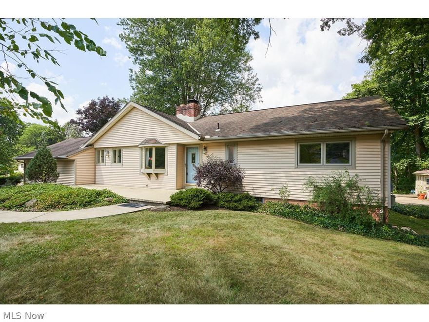 3-4 bedroom, 2 full bath RANCH home on 3.17 acres with finished walkout lower level.  Kitchen features all new stainless steel appliances.  Living room with gas fireplace has a wall of windows overlooking backyard.  French door leads to deck- ideal for outdoor entertaining.  Formal dining room.  3 bedrooms and a full bath complete the 1st floor.  Hardwood floors on almost entire 1st floor.  An additional 694 sq/ft in the finished, walkout lower level features family room and full bath (this could be a 4th bedroom suite).  2 car attached garage. There is an additional, heated outbuilding that can hold 4 cars, with an oversized garage door to accommodate larger vehicles, a boat, etc.  The outbuilding also has a workshop, atrium with slate floor, and attic.  An additional smaller shed.  Various fruit trees on the property, including apple & fig and vegetable gardens. Free Gas. This is a must see!