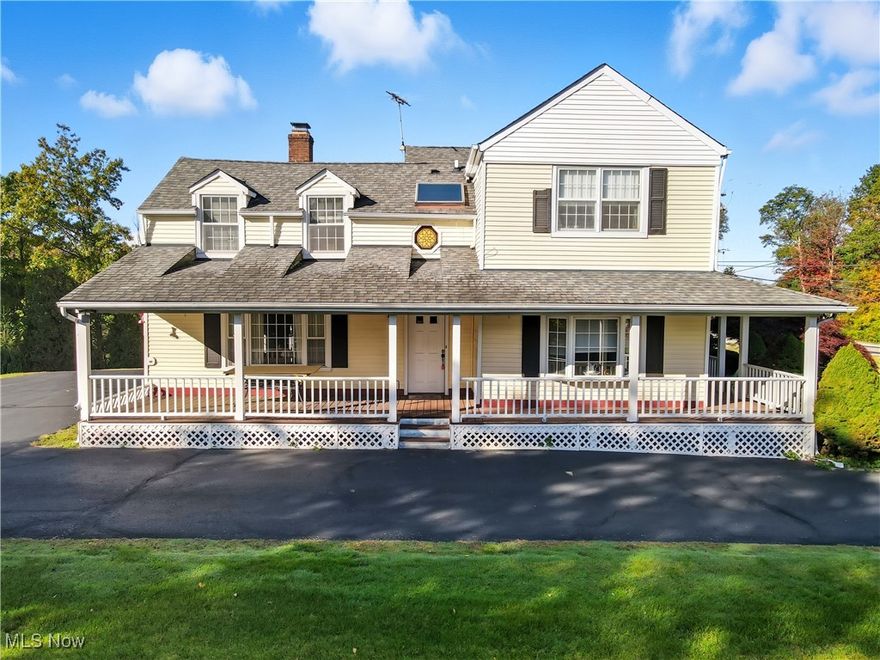 Here is your chance to own that beautiful colonial home with a wraparound porch on the hill in Willoughby Hills!  Four bedrooms home with stunning porch for your morning coffee.  1.25 acres for all your entertaining and family get togethers.  This home has a large living area with a wood fireplace and an extra-large dining room.  This is the perfect place for the Holiday get togethers.  The kitchen is beautiful with custom wood cabinets and wood floor.  Half bath is on the main floor.   Upstairs the master bedroom has all-natural lighting in bedroom with a skylight above the jacuzzi tub.  Three additional bedrooms on the second floor with a full bath.  HVAC 2021, Roof 2019, water heater 2021, gas stove in kitchen 2024, dryer 2024.