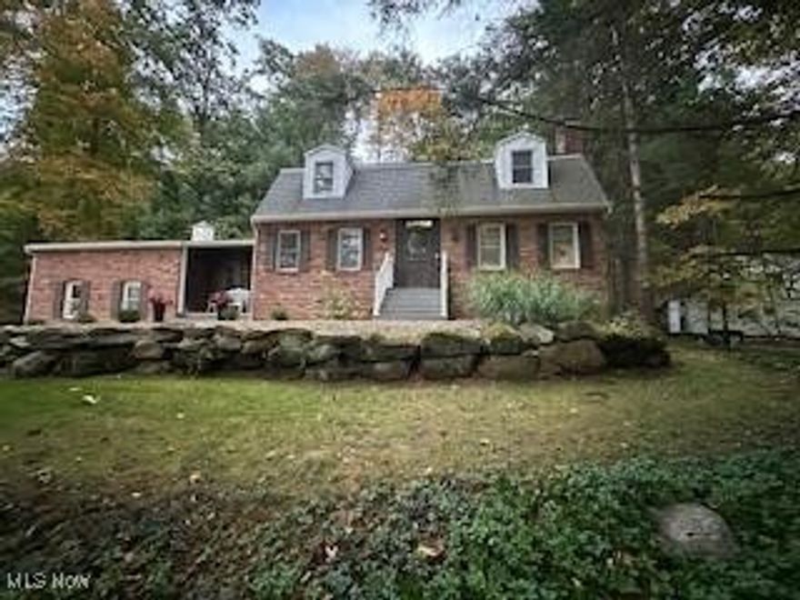 Tucked away on 2.42 private, wooded acres, this charming retreat blends natural beauty with timeless character. The home features 3 bedrooms and 1.5 baths, highlighted by hardwood floors throughout and the warmth of three wood-burning fireplaces, creating inviting spaces to gather and unwind. Step outside to enjoy a multi-tiered deck overlooking the peaceful landscape, complete with a stone waterfall feature that adds a serene, resort-like ambiance—perfect for relaxing or entertaining. A 12x20 shed with electric provides excellent storage or workshop potential. Surrounded by nature yet offering comfortable living spaces, this property is ideal for those seeking privacy, charm, and a true connection to the outdoors.