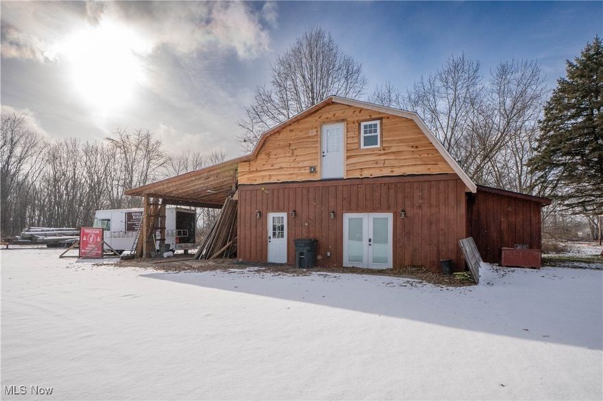 Rare income-producing opportunity on over 2 acres in a convenient Massillon location. The highlight of this unique property is a spacious, remodeled barndominium offering exceptional rental or owner-occupant potential. Featuring soaring ceilings and versatile living space, the open-concept main level includes a large living area with a wood-burning stove, an eat-in kitchen with custom details and stainless steel appliances, and a half bath. The upper level offers additional bedrooms, a full bath, loft space, and access to an upper deck—ideal for enjoying the surrounding open land.
An additional single-family home on the property provides a second rental opportunity, featuring a comfortable living room, eat-in kitchen with ample cabinetry, and two bedrooms sharing a full bath. Outdoor amenities include covered patio areas and plenty of usable land. With multiple income-producing structures on one parcel, this property offers excellent flexibility and strong investment potential. Don't miss this once in a lifetime investment opportunity!