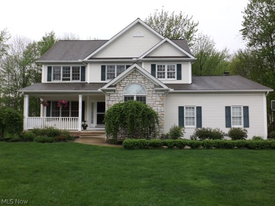 Beautiful! Come visit this transitional style with a stone front accent and a quiet private treed backyard in Hawthorn which is a recreation community with pool, tennis, playground, community center and a 305 acre lake for your use.  There are beautiful hardwood floors throughout the first floor living area featuring a living room, dining room and family room with a fireplace with gas logs and many windows affording lots of natural light.  Open from the family room is the spacious kitchen with cherry cabinets, a center island and an eating area with sliding doors to the deck and backyard.  There is also a den with a  cathedral ceiling and a first floor laundry.  All bedrooms are on the second floor with the master suite featuring a cathedral ceiling and a glamour bath with double sinks, a whirlpool tub and separate shower. The other three bedrooms and full bath are generous in size.  There is a finished lower level with a rec rm and an area for crafts and plenty of room for storage.