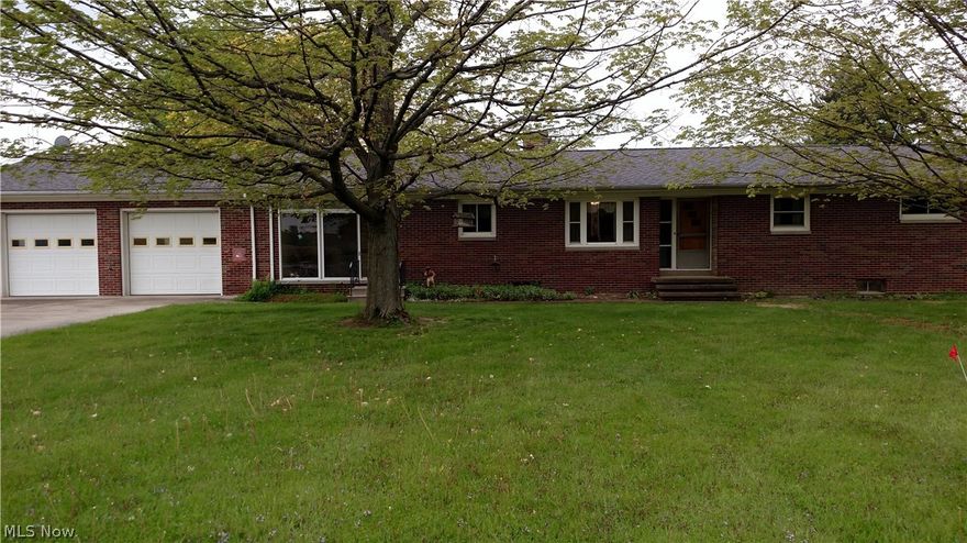 Brick Ranch nestled on 5.82 acres features 40x80 barn with concrete floor, electric and partial heat. FREE GAS up to 3000 ccf. Over 2200 of living space, full basement, and attached garage. Needs updating, but very spacious!!