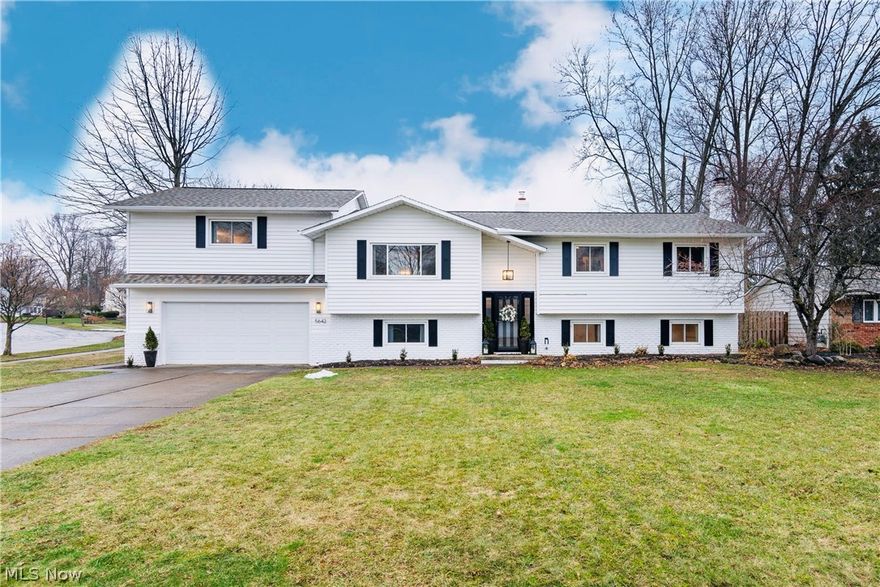 Prepare to be amazed! From the moment you walk in, you will instantly fall in love! This expansive, nearly 3,000 square foot renovated home defines move-in ready luxury. Ideally situated on a spacious lot just minutes from downtown Willoughby, it blends splendid design, thoughtful functionality, and high-end finishes with over $180,000 in updates and renovations completed by the current owners. 2023/2024 The main living level features four generously sized bedrooms, with the primary suite positioned just a few steps above the open-concept living space. The kitchen is the heart of the home showcasing custom cabinetry, quartz countertops, a massive island, all new appliances including new lighting and marble backsplash with an adjoining spacious dining area. Rich hardwood floors flow throughout, adding warmth and elegance, while the living room offers built-in bookshelves and a cozy fireplace. The primary suite renovation is exceptional. Designed for true comfort and luxury, it includes French doors, a walk-in closet, hardwood floors in the bedroom area, marble vanity with dual sinks, new lighting, a freestanding soaking tub, walk-in shower, heated marble floors in the bath area, and a smart bidet. It feels like a private spa retreat. Serving the additional bedrooms, the updated bathroom connects one bedroom and the hallway for guest access. It showcases honeycomb ceramic tile flooring, updated lighting, and a stylish double vanity.  Another bedroom is currently used as a home office featuring architectural wood detailing. The lower level offers incredible flexibility with a secondary living area featuring a cozy fireplace, a fifth bedroom, a full bathroom, additional storage/office area and access to the attached two-car garage and laundry room. Major mechanical and exterior improvements provide true peace of mind!  Not an inch of this home was overlooked. Easy access to I-90 for commuting to downtown Cleveland and nearby hospital systems. Simply move in and enjoy.