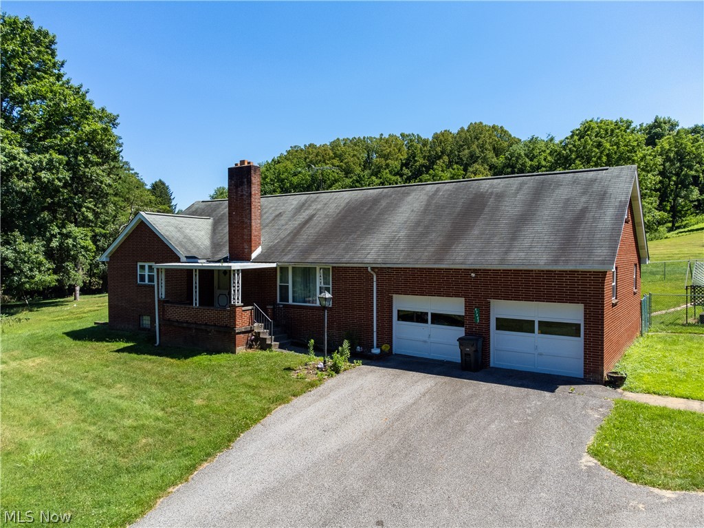 This family home was built in 1962 and includes an oversized detached garage. This property is situated on 5.73 acres. Spacious rooms including a large eat in kitchen with direct access to a backyard covered patio and fenced area. This home is in it's original condition. Due to the proximity to I-70 and the west side of St Clairsville this property offers this property is well suited for commercial consideration